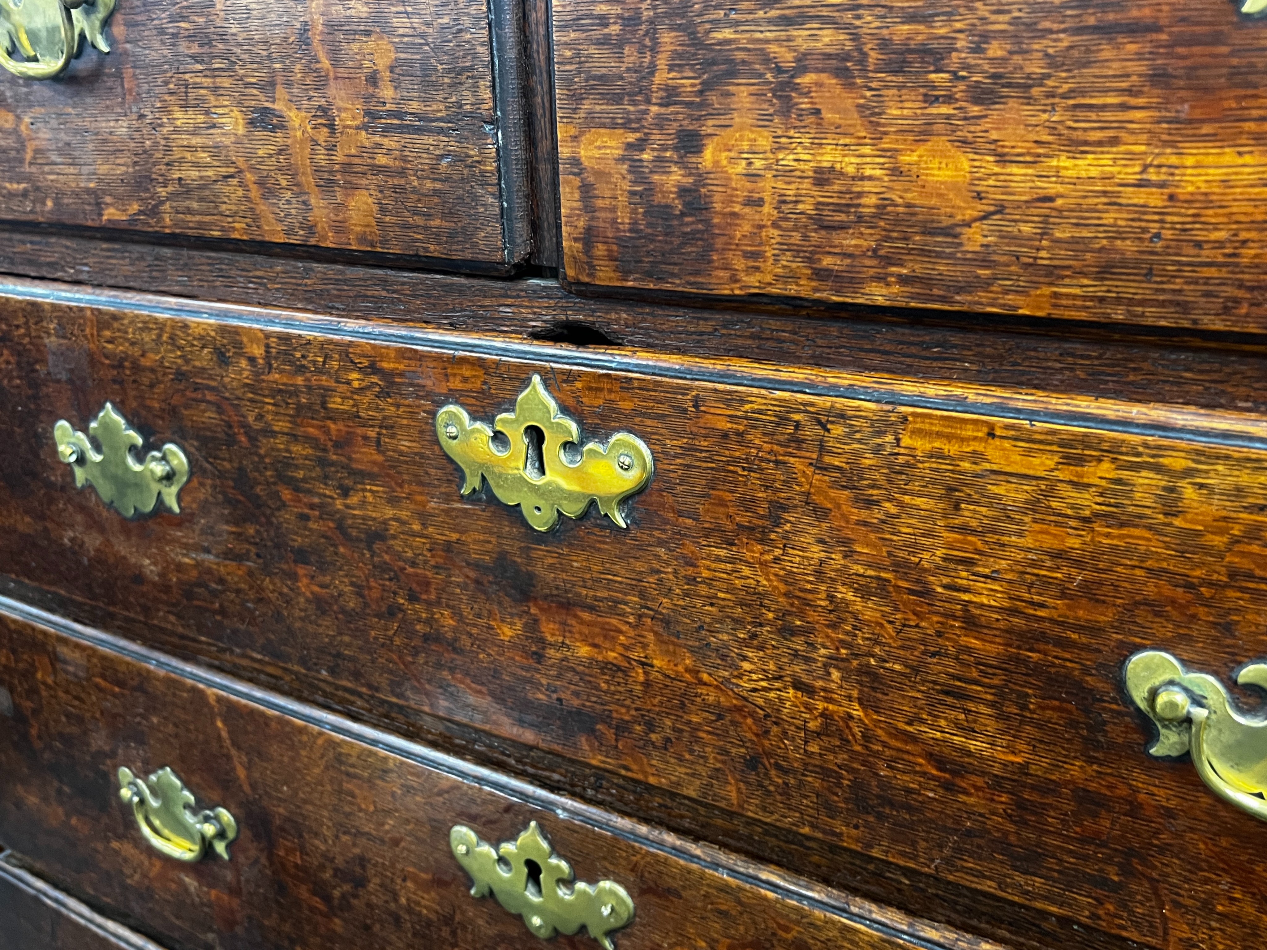 An 18th century oak chest on stand, width 99cm, depth 48cm, height 154cm